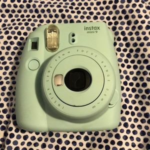Baby blue Polaroid camera